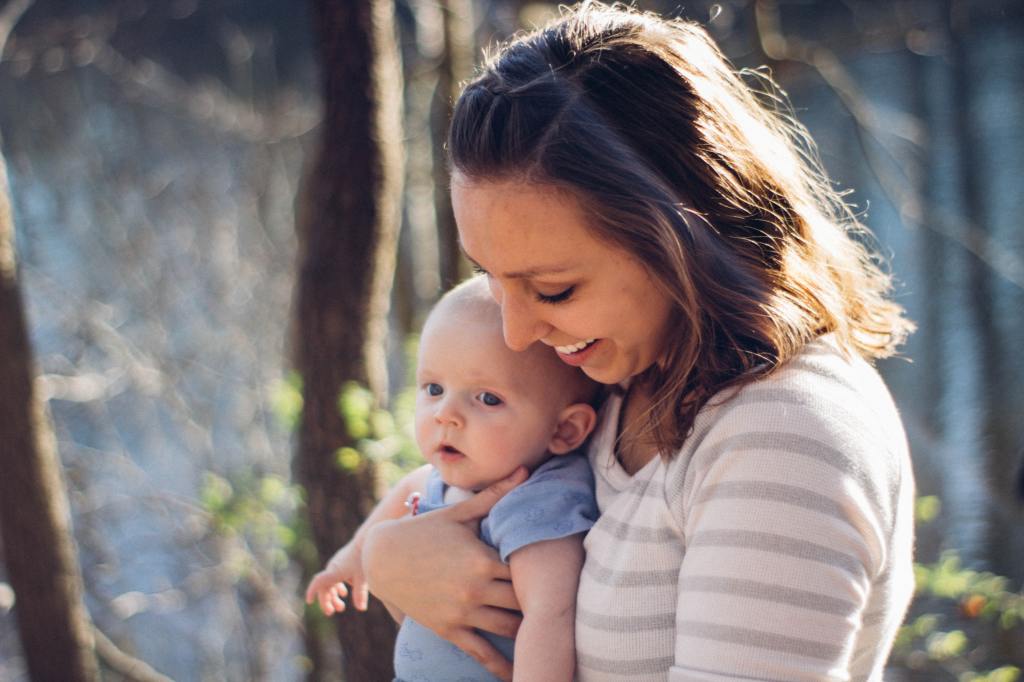 Woman holding a small baby