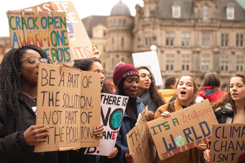 climate change protest with teenagers holding placards